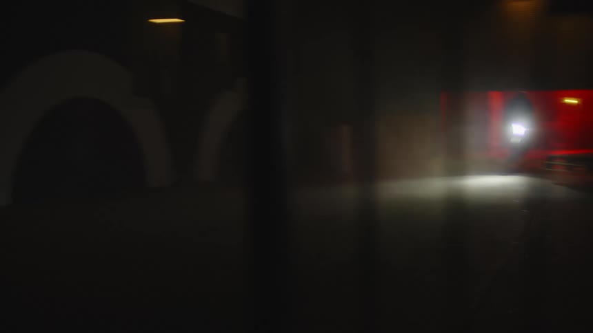 A motorcycle races down the alley