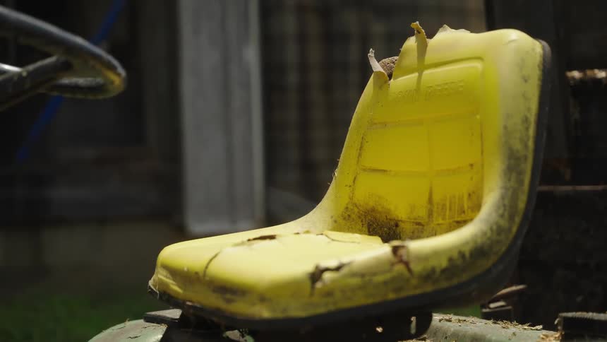 Closeup of an old yellow vehicle seat