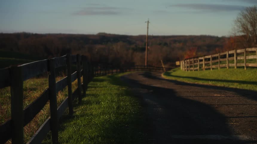 Clay street surrounded with wooden fence