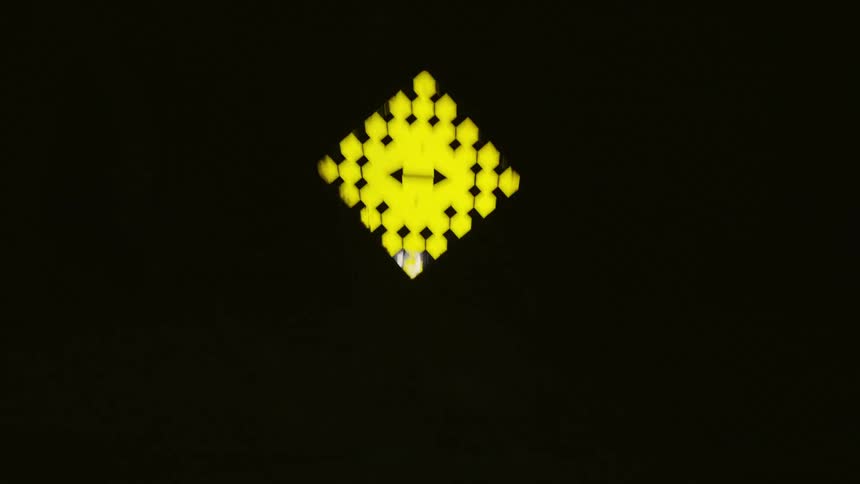 Yellow signpost in the middle of darkness