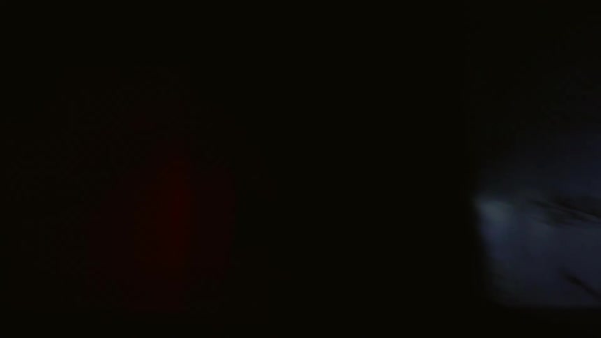 Person riding a bicycle in the woods at night