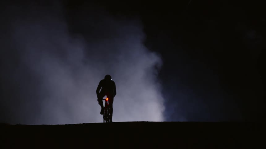 A clip of a cycler cycling into the mist