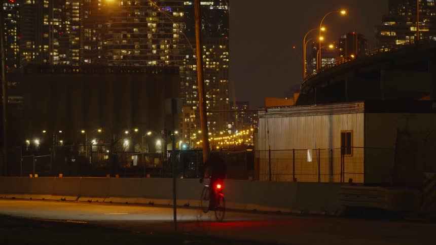 A bicyclist jumps a speedbump on a road never a city
