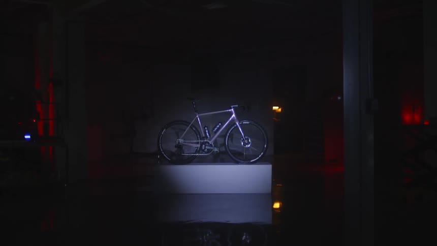 Light on a still bicycle in a dark room at night