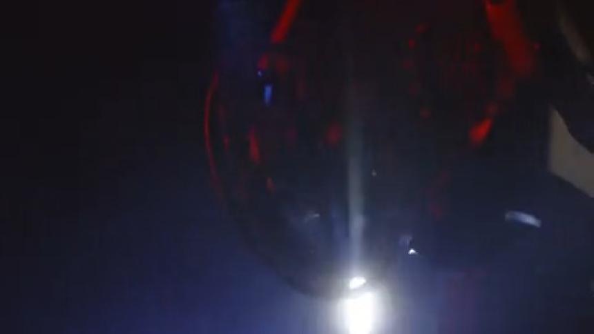 Close up of the wheel bearing of a moving bicycle at night