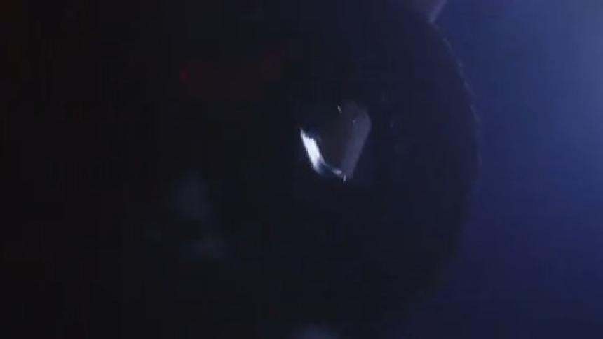 A person is biking at night