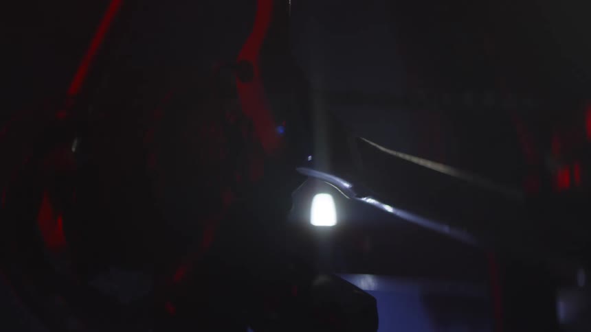 Machine with moving wheel in a lowlight environment