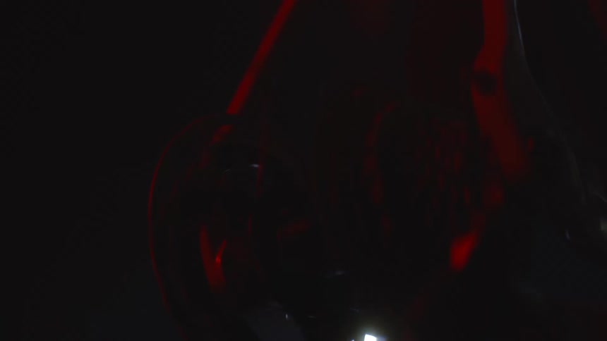 The bicycle wheel spins fast at night
