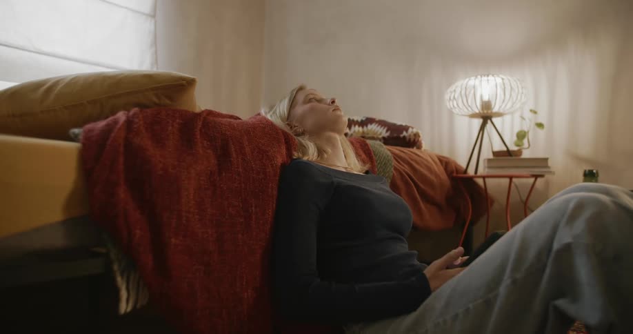 A clip of a female blonde contemplating in a room