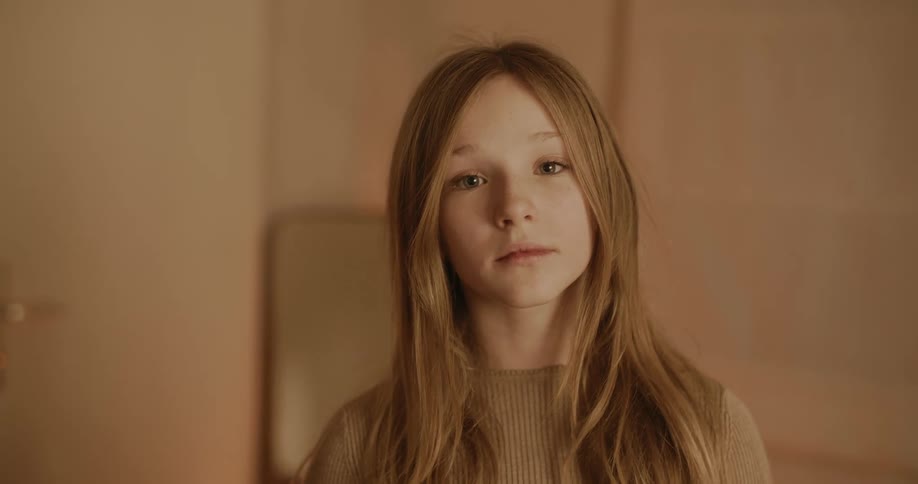 A girl looks up in the room
