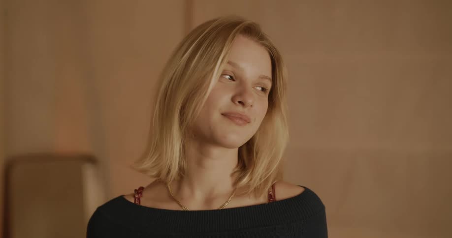 A woman smiles and laughs