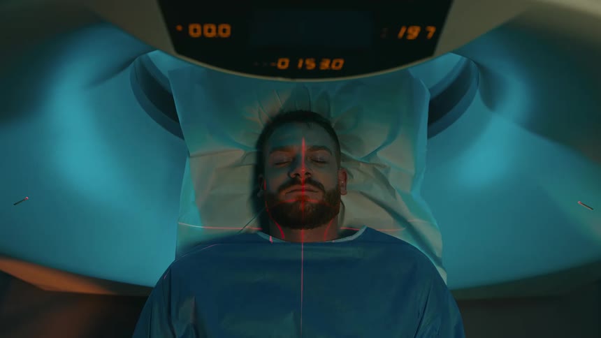 A patient undergoing an examination in an mri machine