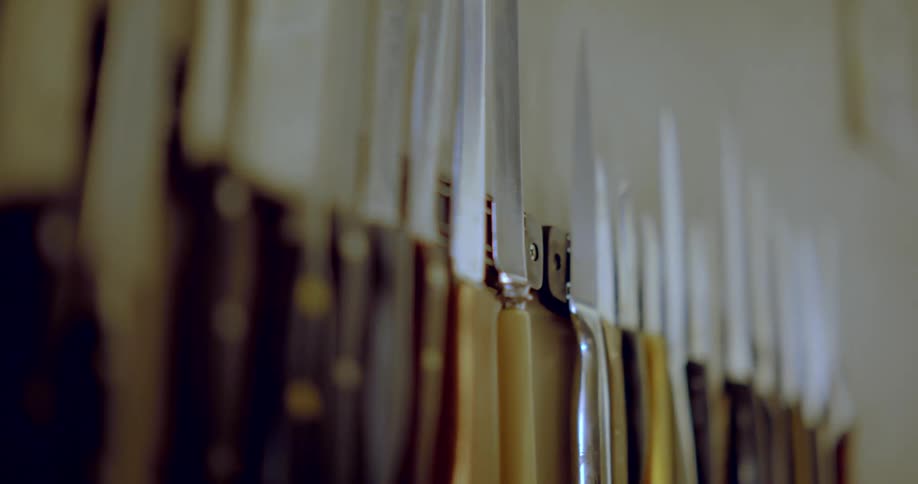 Knives hanging on a kitchen wall