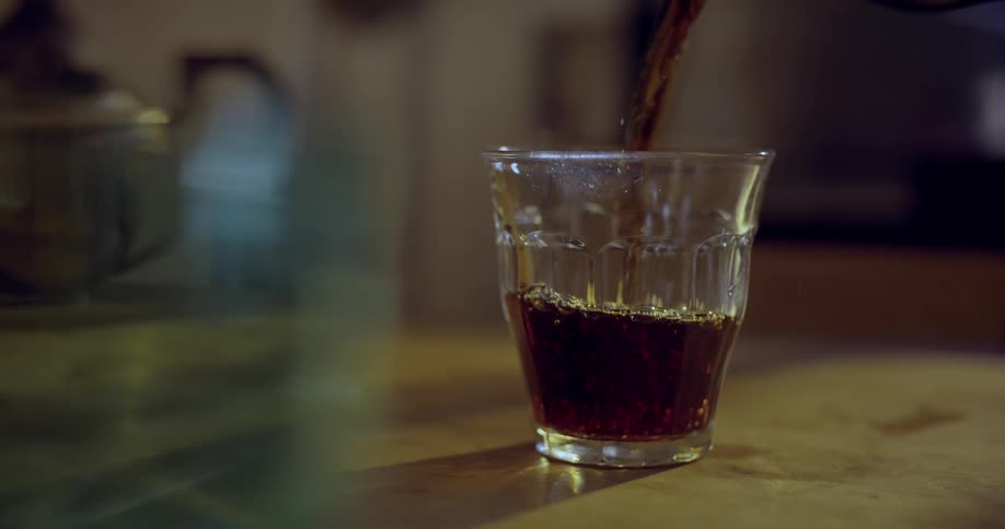 SLow motion shot of beverage being poured
