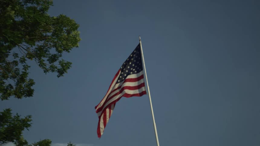 United states flag on a white pole