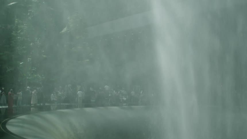 People around a modern fountain