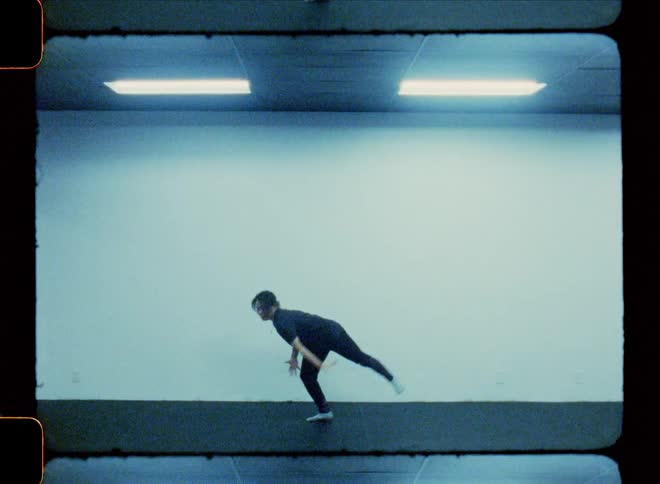 Woman dancer inside a studio performing the solo