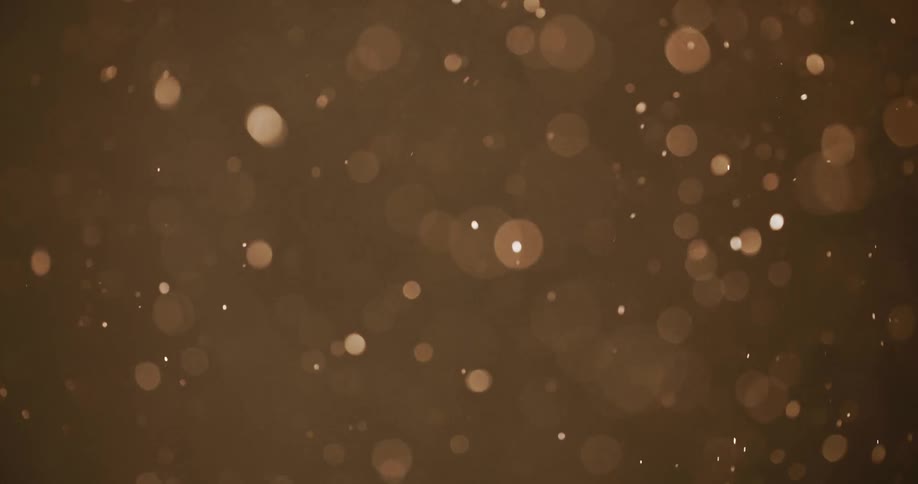 Sparks and dots of light float through the air