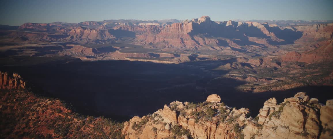 A large canyon among rocky mountains