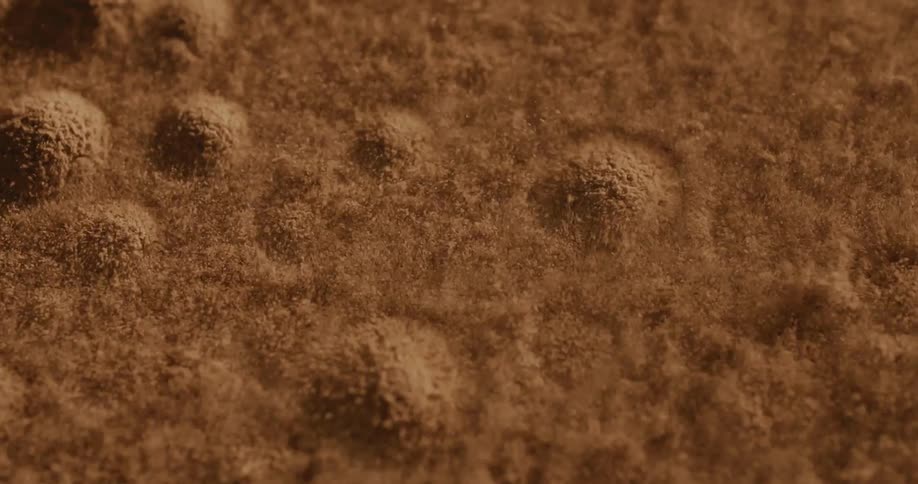 Extreme close up on sand bouncing