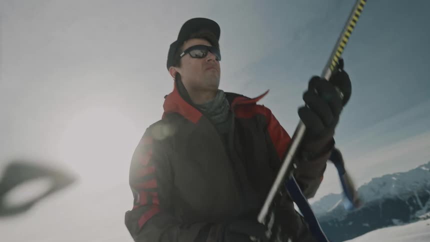A skier preparing equipment for a skitour