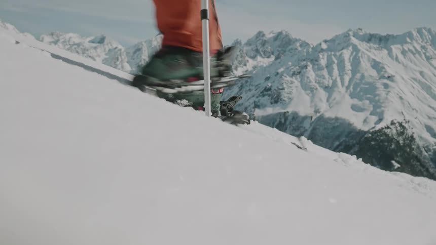 A person skitouring steep slope