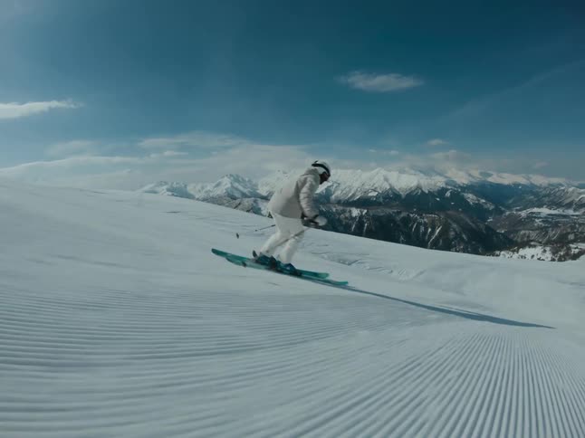 Skier riding at high speed down a slope
