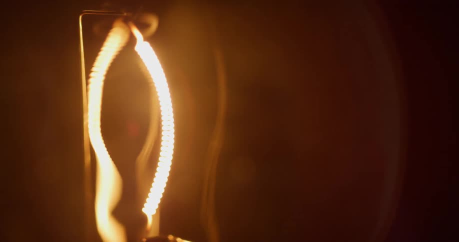 A light bulb flashes brightly and then dims