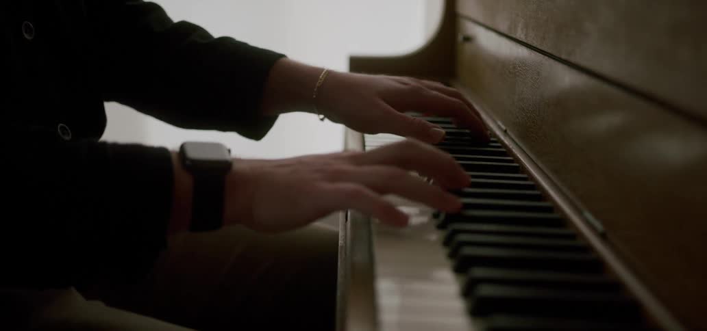 Close up of the hands of an artist playing the piano