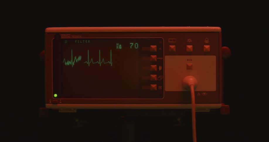 A hospital machine in a dim room