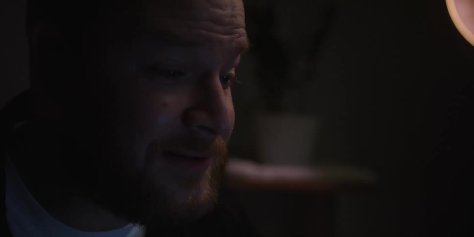 A man in an office talking to someone