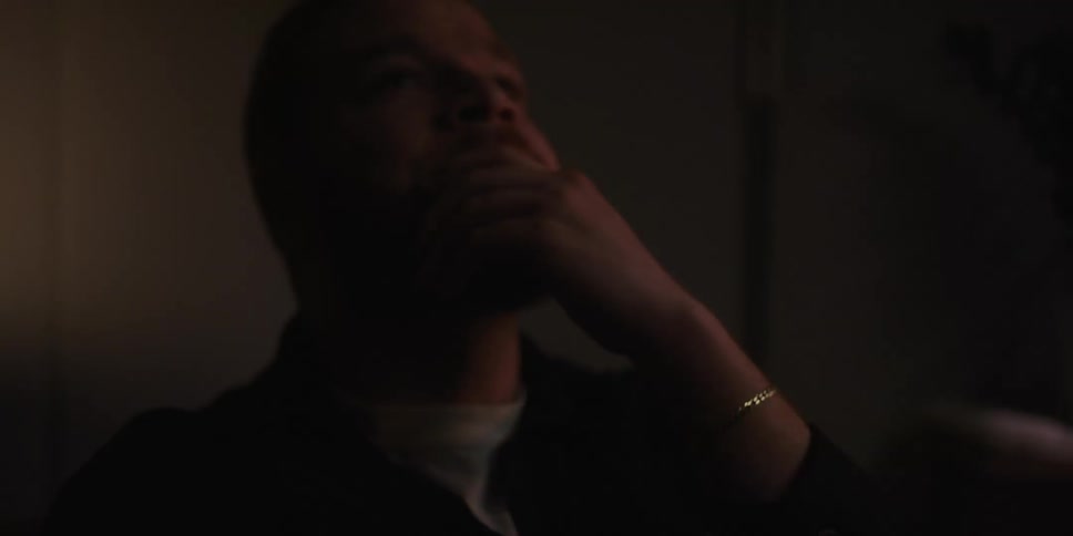 Portrait of a man placing his hand on his face in distress