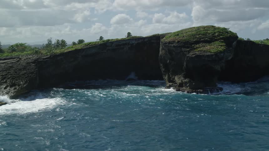 Aerial panorama of the coast with crystal clear sea water lapping hard