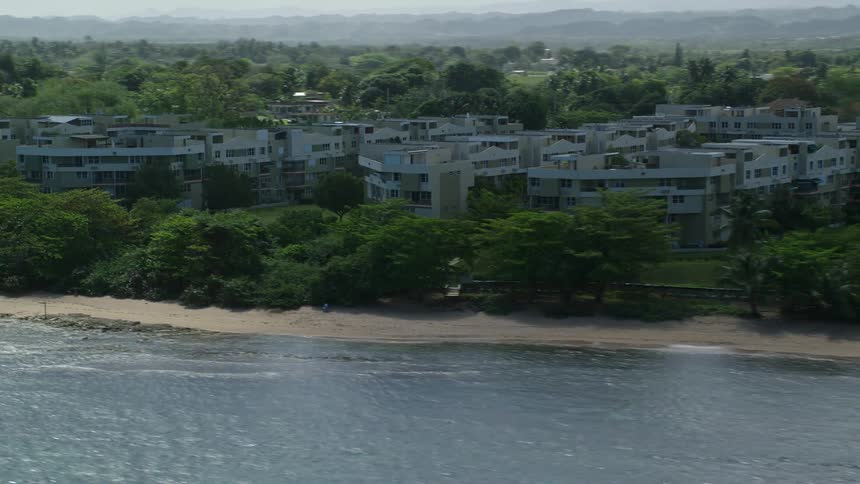 Aerial view of a beachfront town next to the ocean