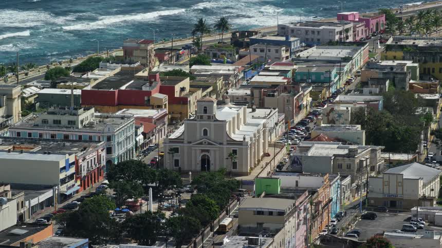 Aerial panorama of one and a half churches and a seaside town