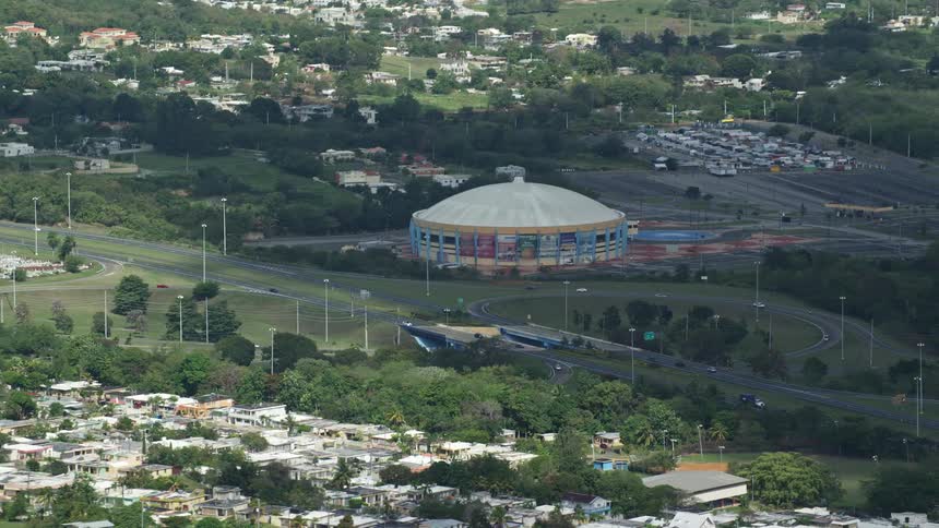 Aerial panorama from one and a half stadiums to a residential city