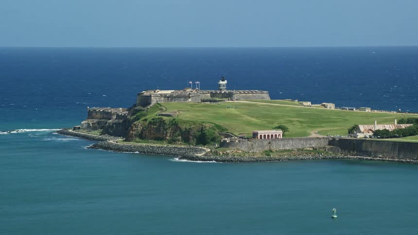 Aerial panorama of a fort by the sea on a peninsula on a clear bluesky day without clouds