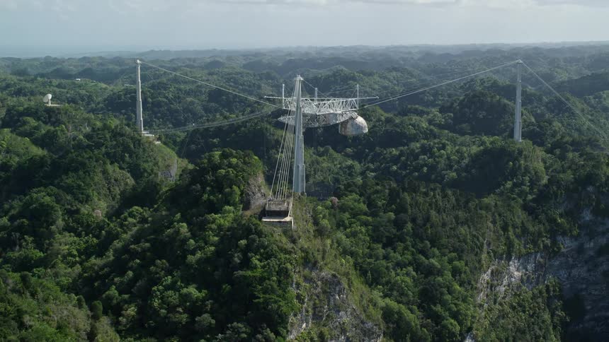 A wire bridge is over a bowl shaped dome