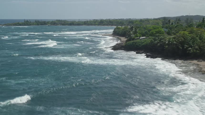 Waves crash against the island shore