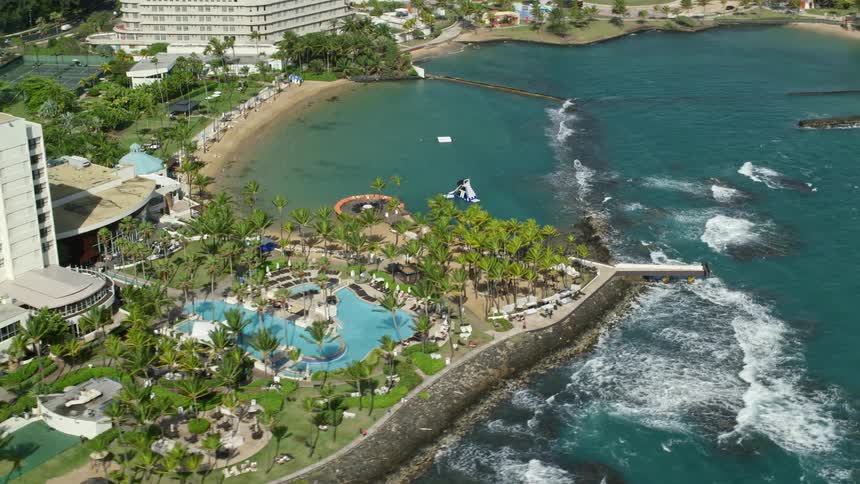 A hotel resort sits on the coast