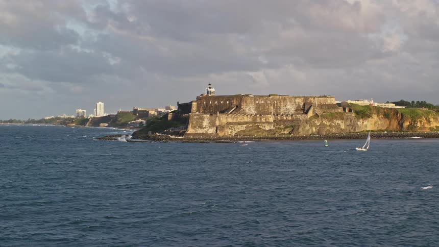 A boat is docked outside the fortress