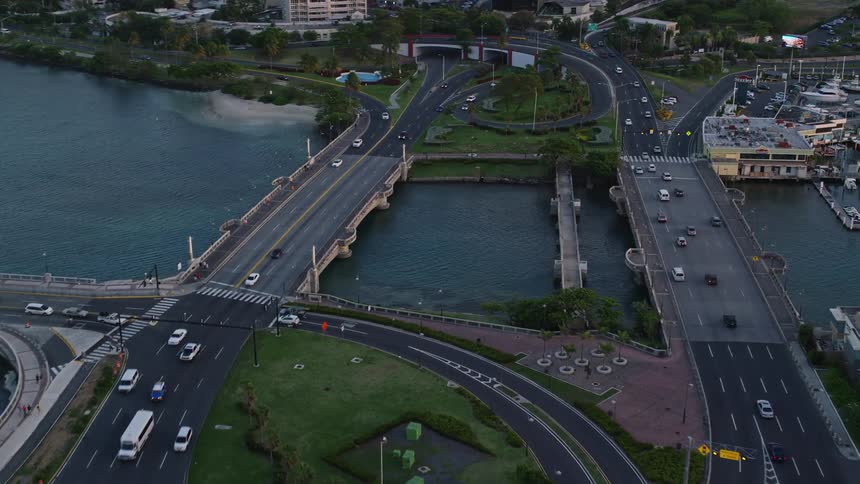 Aerial view of a complex highway system to enter and leave a city by crossing bridges over a river