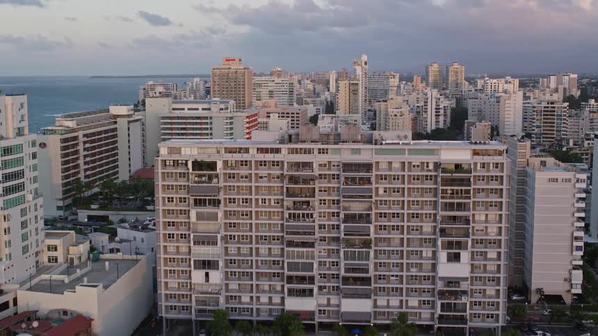 Aerial panorama of a seaside metropolis on a purple sky day