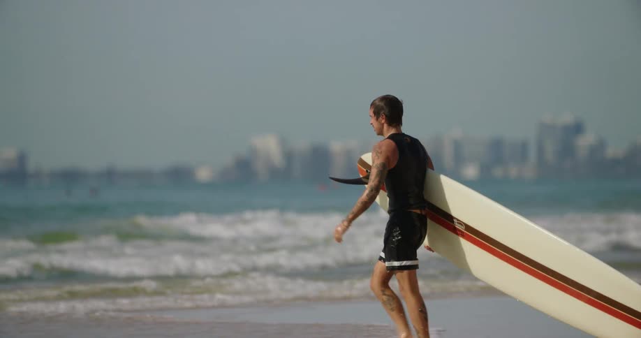 A man is surfing in the water