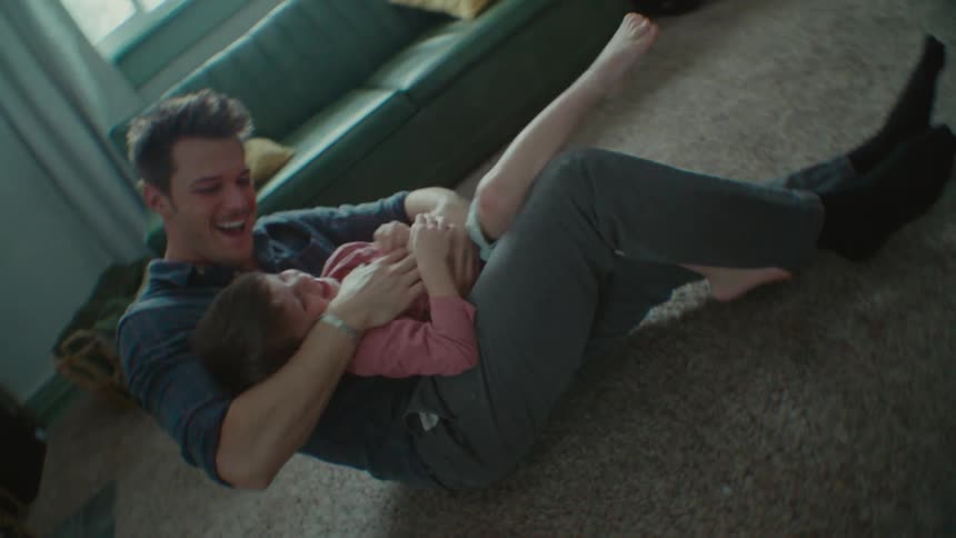 A father and son play along at home