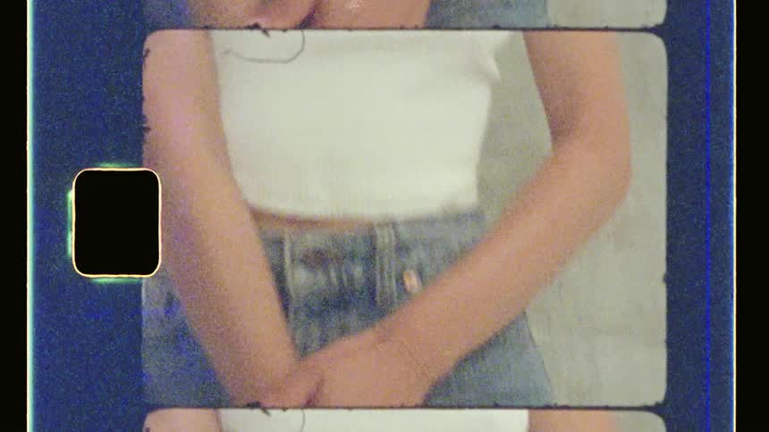 Woman modeling in blue jeans and a white shirt