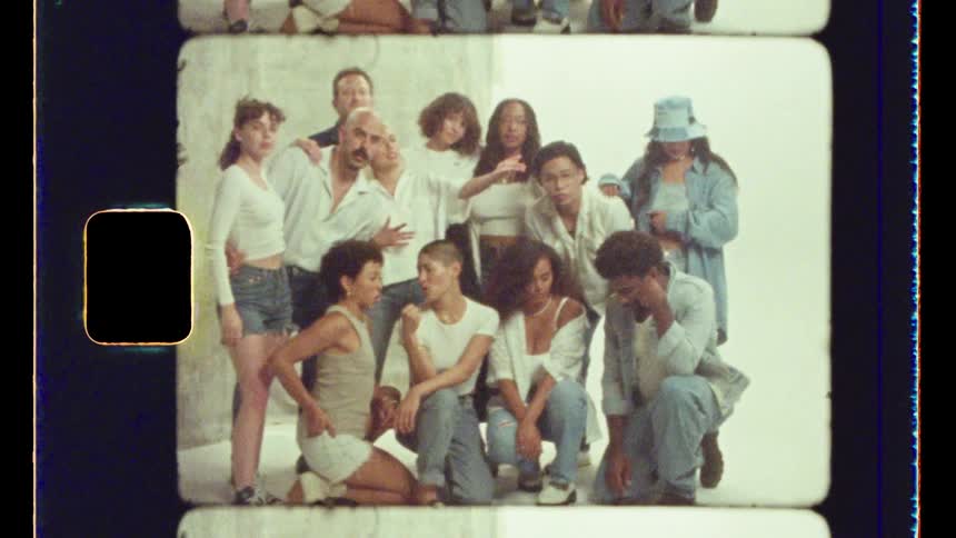 A group of models laugh and pose