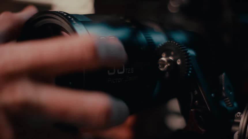 Lens being placed on a professional camera