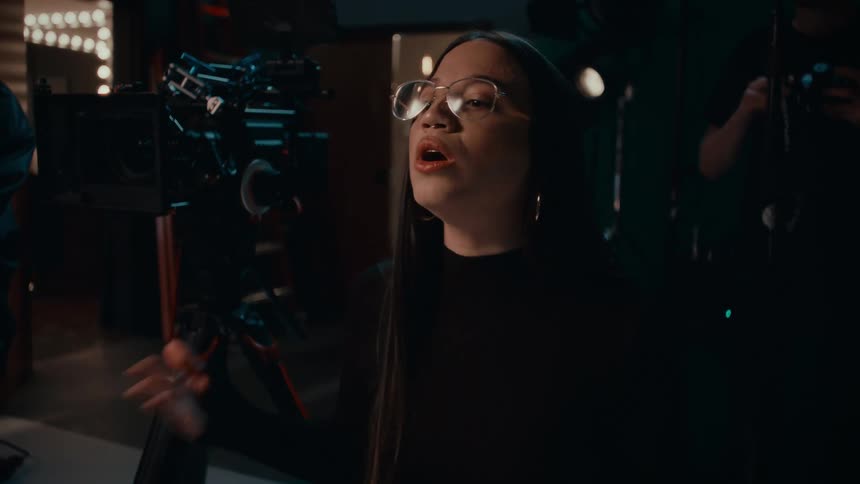 A female director instructs someone on how to act