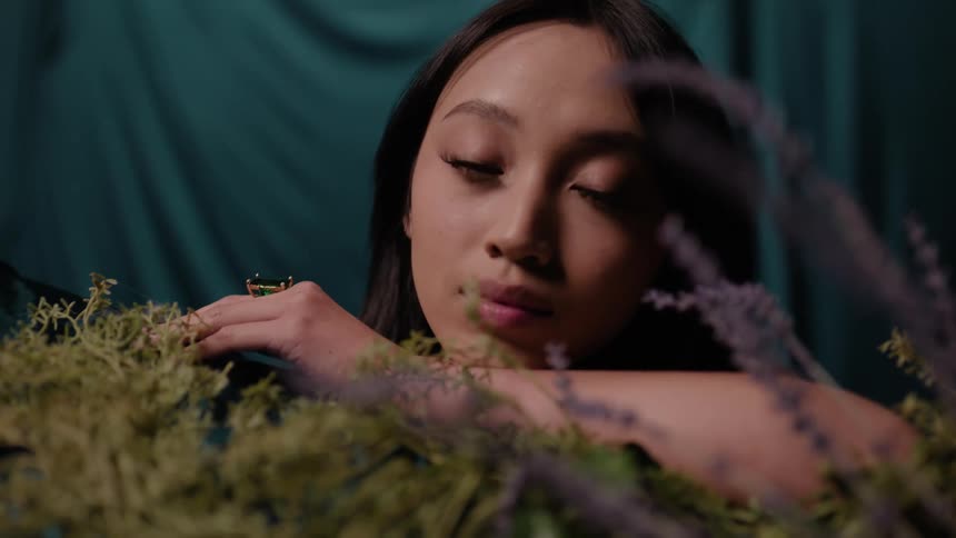 A woman is leaning on lavender